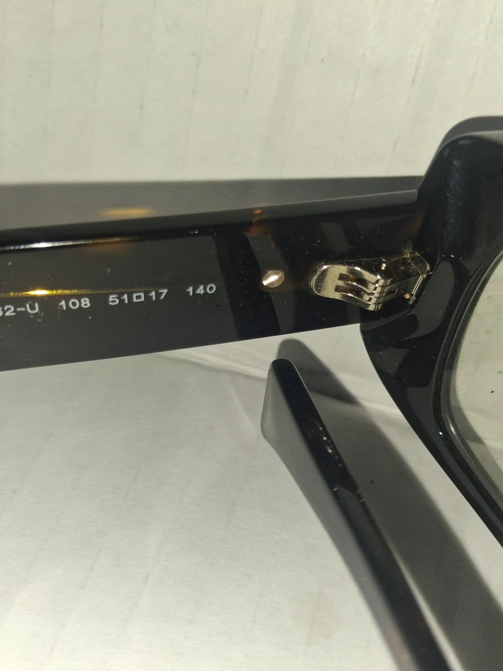 Versace VE3362U eyeglasses feature a bold, rectangular black frame with thick te